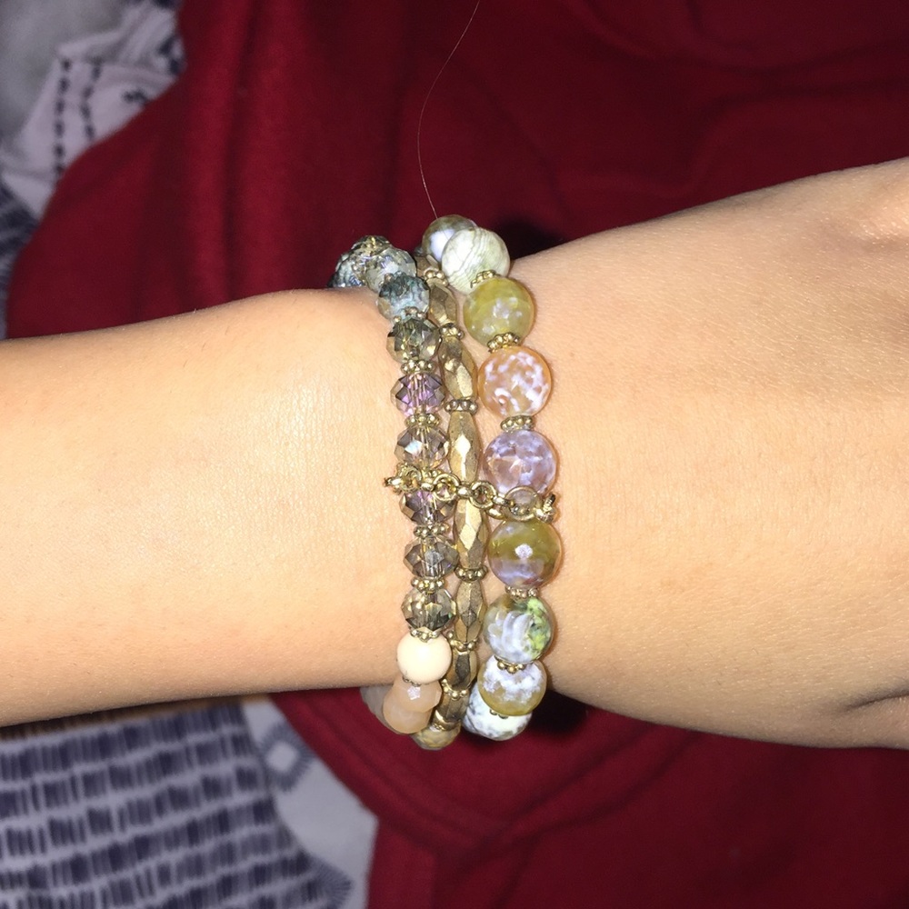Set of three bracelets, one has a tassel attached